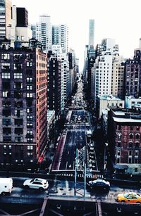 High angle view of traffic on city street and buildings