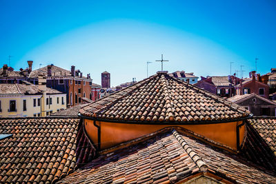 Houses in city against clear blue sky in venice, italy