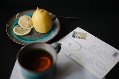 Close-up of breakfast on table against black background