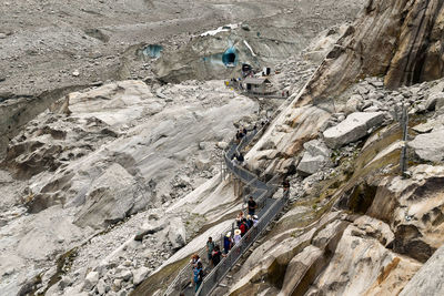 High angle view of people on rock