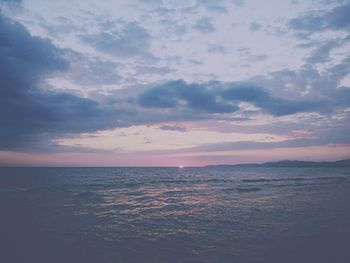 Scenic view of sea against cloudy sky