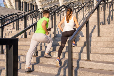 Woman sitting on staircase