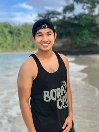 Portrait of young man at beautiful white sand beach, boracay