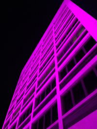 Low angle view of illuminated building at night