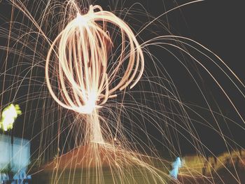 Low angle view of wire wool at night