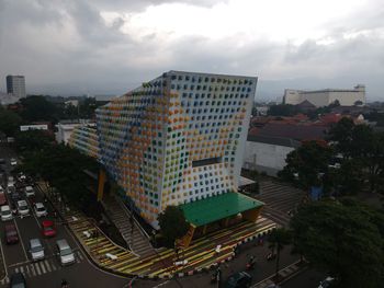 High angle view of buildings in city against sky