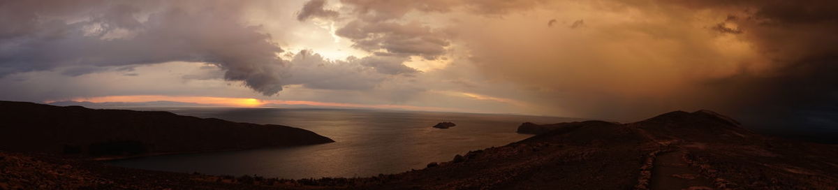 Panoramic view of sea against sky during sunset