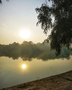 Scenic view of sunset over lake