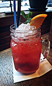 Close-up of drink in glass jar on table