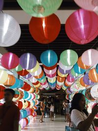 People in multi colored balloons