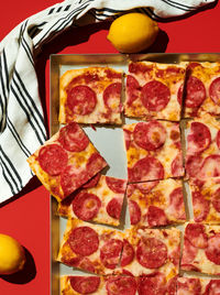 Close-up of pizza slices in tray on table