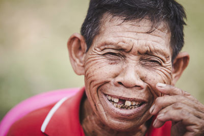 Close-up portrait of smiling senior man