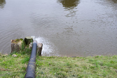 High angle view of wooden post in lake