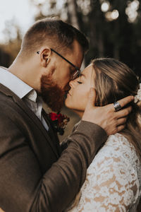 Portrait of couple kissing outdoors