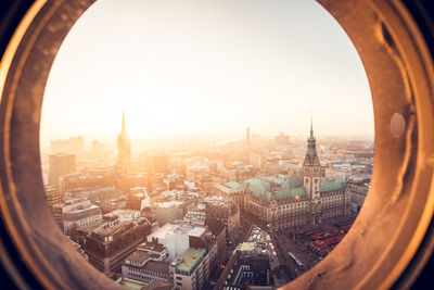 Aerial view of city buildings against sky