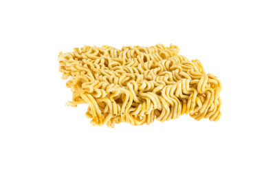 Directly above shot of pasta against white background