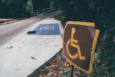 High angle view of arrow sign on road