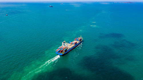 High angle view of people sailing in sea