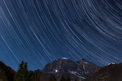 Scenic view of mountains against sky at night