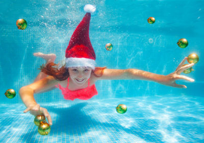 High angle view of woman swimming in pool