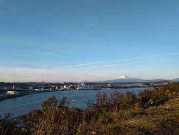 Scenic view of river against blue sky