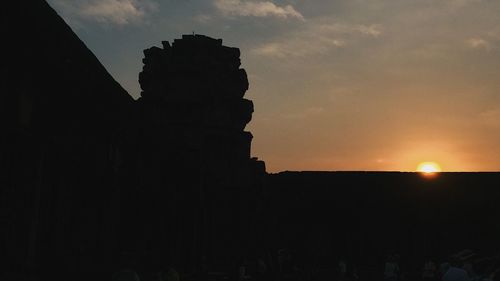 Silhouette of building during sunset