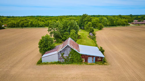 House on field against sky