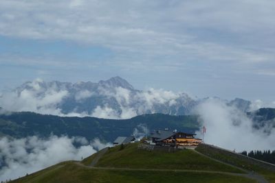 Scenic view of landscape against cloudy sky