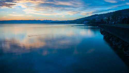 Scenic view of lake at sunset