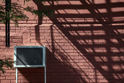 Air duct on wall with shadow