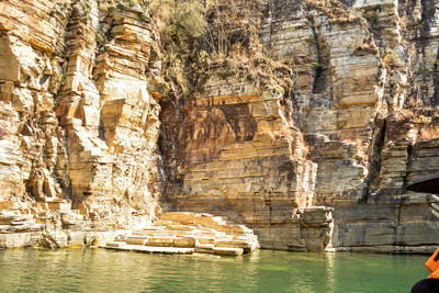 View of rock formations in water