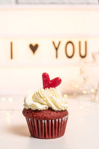 Close-up of cupcakes with decorations on table