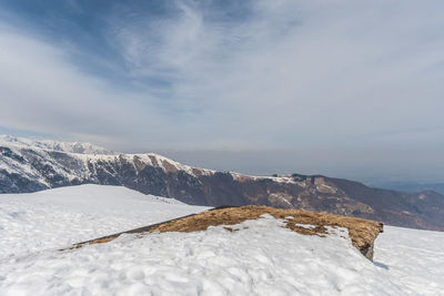 Scenic view of mountains against sky during winter