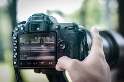 Close-up of hand holding camera