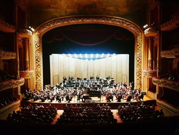 High angle view of crowd sitting in music concert