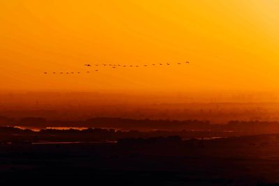 Scenic view of landscape at sunset