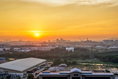 High angle view of buildings against sky during sunset