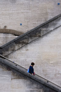 High angle view of man standing on bridge