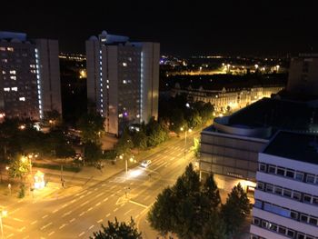 High angle view of illuminated city buildings at night