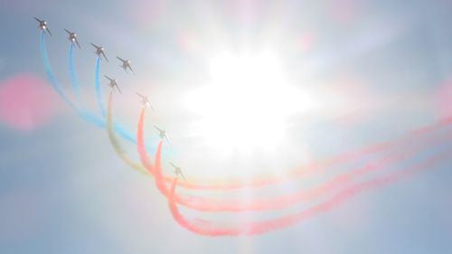 Low angle view of vapor trails against sky