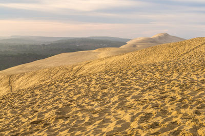 View of sandy desert against sky