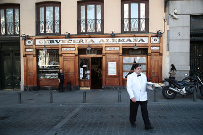 Woman standing in front of building