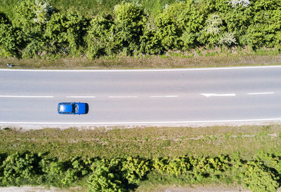 Car on road amidst field