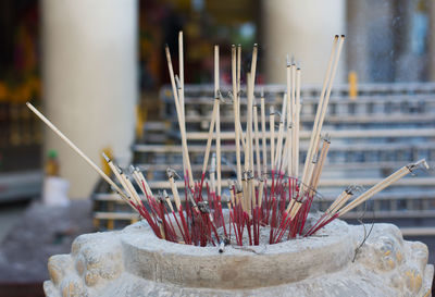 Close-up of cross in temple against building