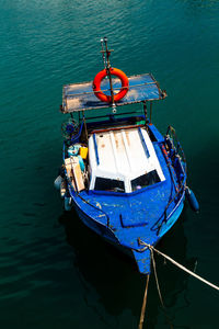 High angle view of fishing boat moored in sea