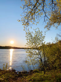 Scenic view of lake against sky during sunset