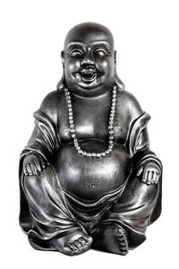 Close-up of buddha statue against white background