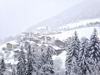View of residential district on a snow covered mountain range