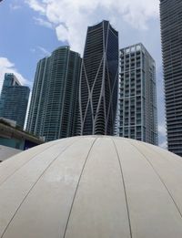 Low angle view of modern buildings against sky in city