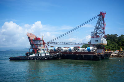 Ship in water against sky